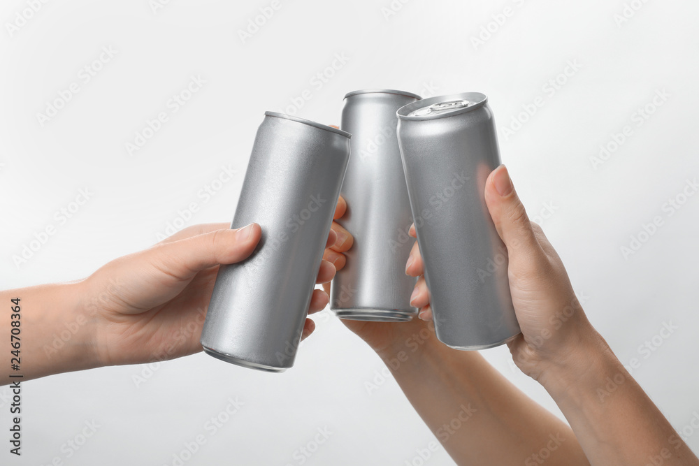 Poster People holding aluminum cans on white background, closeup. Space for design