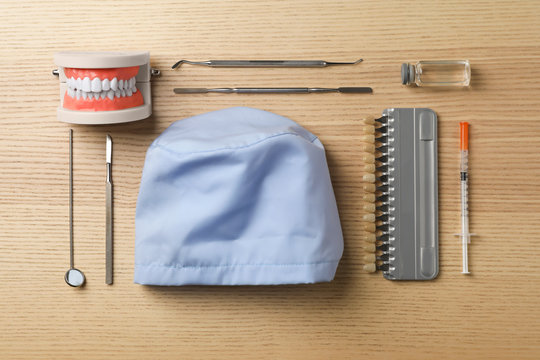 Flat lay composition with medical objects on wooden background
