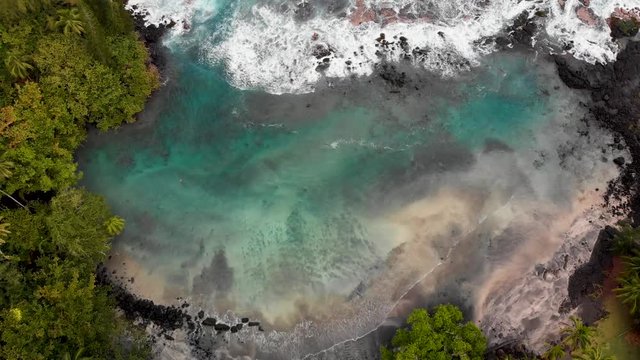 aerial dolly tilt down from horizon of shipman beach puna Hawaii