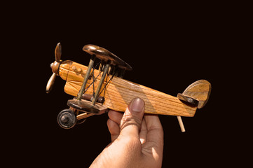 toy plane in hand on white background