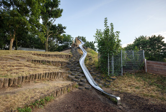 Metal slide installed on the children playground in the Prater park. Vienna, Austria