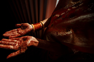 Close-up of Hindu bride's hands covered with henna tattoos