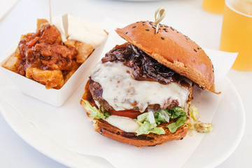burger with beef, tomato, cheese and lettuce