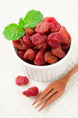 Dried Strawberries in white cup.