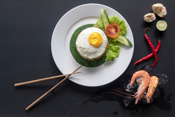 Asian dish fried rice with egg and seafood.