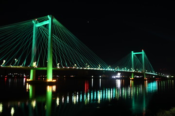 Fototapeta na wymiar Bridge at night in green lights