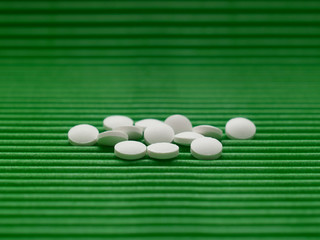 pills on green background