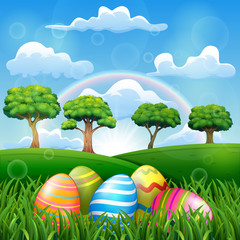 Easter egg on the grass field with a rainbow background in beautiful nature