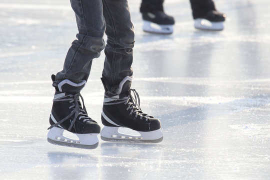 people skating on the ice rink