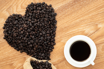 coffee bean on wooden background. coffee lover concept.