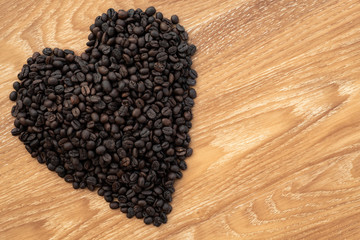 coffee bean on wooden background. coffee lover concept.