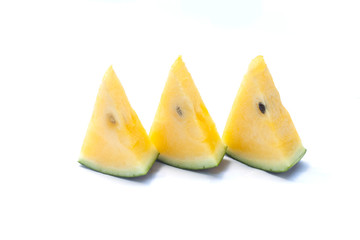 Closeup sliced of yellow watermelon isolated on white background.