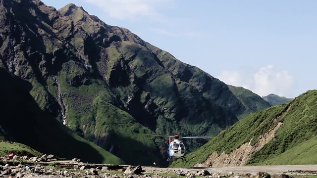 Government helicopter lands in the Himalayan Mountains in the Himalayas in Kedarnath, India.