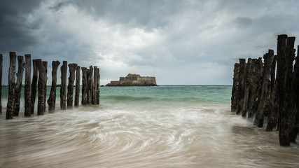 The beach and Fort National during high tide in Saint Malo