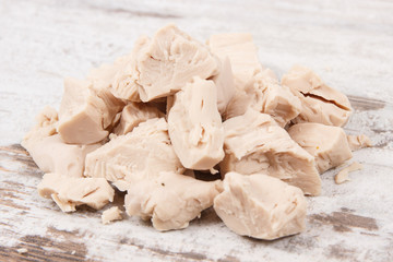 Fresh crumbled yeast for baking or preparing sourdough