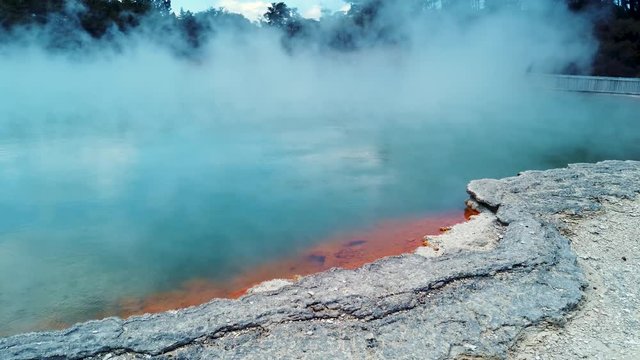 Blue and orange volcanic lake in Rotorua, New Zealand. The "champagne pools" 4k