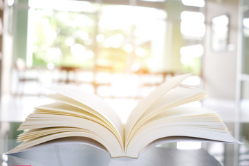 book is open. Put on the table in the library, study ideas and hobbies.