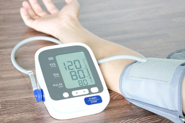 Human check blood pressure monitor and heart rate monitor with digital pressure gauge. Health care and  Medical concept