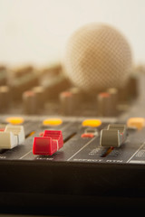 Slide the button to adjust the volume mixer of audio professionals. In the studio recording.