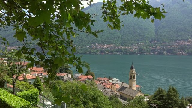 Old church in town at the coast of Como lake, Italy, 4k
