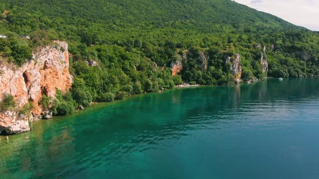 Aerial shot of Macedonia coast. Clif and beautiful water around Ohrid Lake in Southern Europe neer Pesztani and Gradiste.
