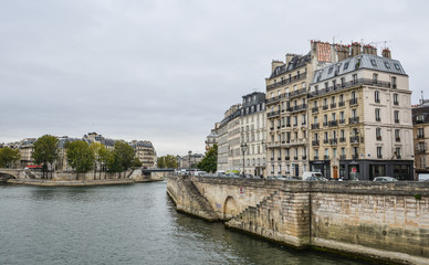 Fototapeta premium Landscape of Seine River with old bridges