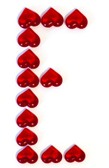 the letter E on a white background is made of red hearts