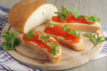 Sandwiches with butter and red caviar	