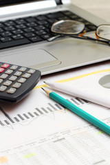 Business concept with a report, money and a calculator