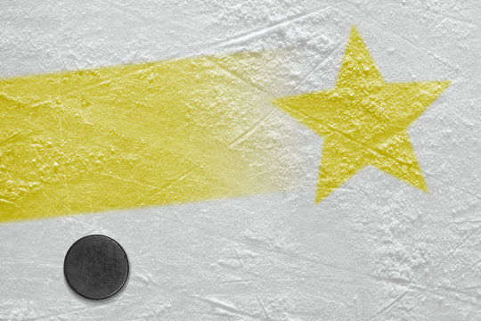 An image of a yellow line with a yellow star on ice and a hockey puck