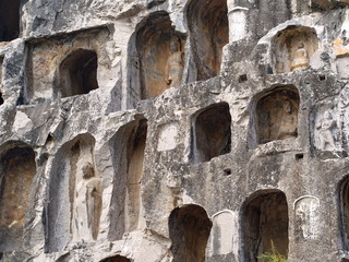 Luoyang Longmen grottoes. Broken Buddha and the stone caves and sculptures in the Longmen Grottoes in Luoyang, China. Taken in 14th October 2018