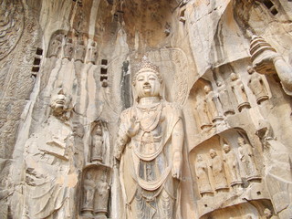 Fototapeta na wymiar Luoyang Longmen grottoes. Broken Buddha and the stone caves and sculptures in the Longmen Grottoes in Luoyang, China. Taken in 14th October 2018