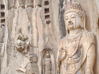 Luoyang Longmen grottoes. Broken Buddha and the stone caves and sculptures in the Longmen Grottoes in Luoyang, China. Taken in 14th October 2018
