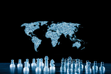 the world map and a game of chess symbolize the struggle for power