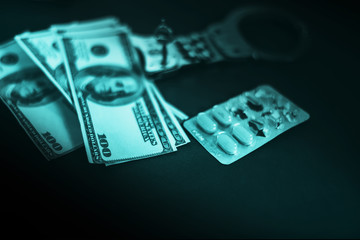 handcuff , money and drug ,Buying freedom, exchange freedom for money to escape from crime