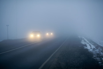 An empty asphalt road in the steppe. Fog on the winter rural road. The Astrakhan region. Russia.