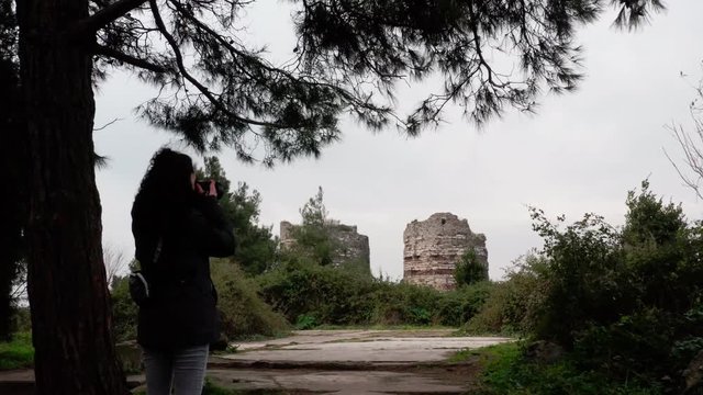 Girl Taking Picture of Old Fortress and Bosphorus Mist Aerial View