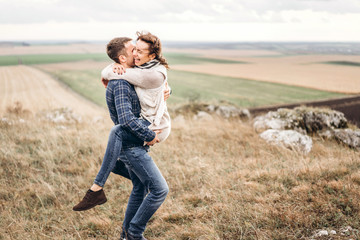 Romantic pretty young couple have fun outdoor.