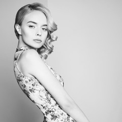 Fashion studio portrait of beautiful blonde woman with classic makeup