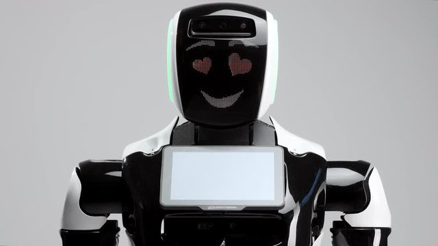 portrait of a modern robot with an electronic face. Modern Robotic Technologies. the robot is looking at the camera. the robot looks into the camera with loving eyes. Hearts icons on eyes.