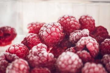 Frozen raspberries, covered with hoarfrost. Macro photo
