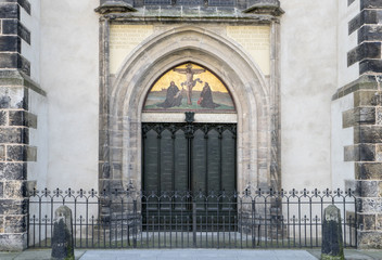 Fototapeta na wymiar Door with theses of the castle church in the Luther city Wittenberg 