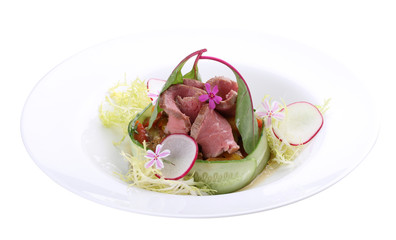 Salad with vegetables and roast beef. On white background.