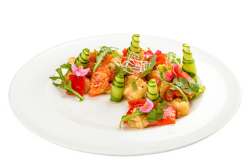 Bright vegetable salad with tofu and rice chips.