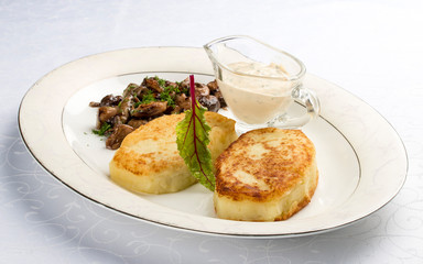 Potato zrazy with a meat filling on a white plate. Traditional Ukrainian zrazy recipe