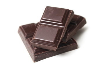 closeup of milk chocolate blocks on white background