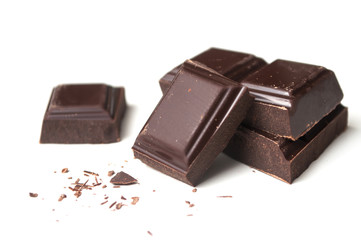 closeup of milk chocolate blocks on white background