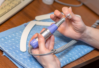 Apparatus manicure at home. Close-up.
