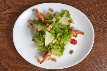 fried shrimp salad with cheese, croutons and cherry tomatoes