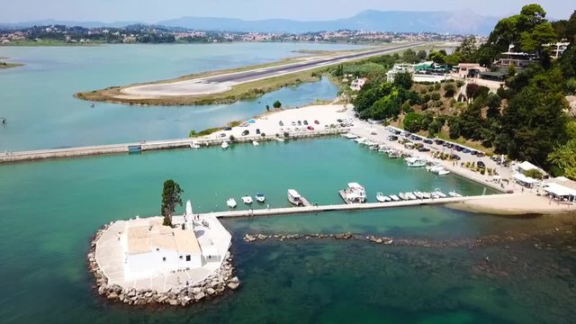 Aerial drone bird's eye view video of famous area of Kanoni near iconic Pontikonissi and airport of Corfu island, Ionian ,Greece